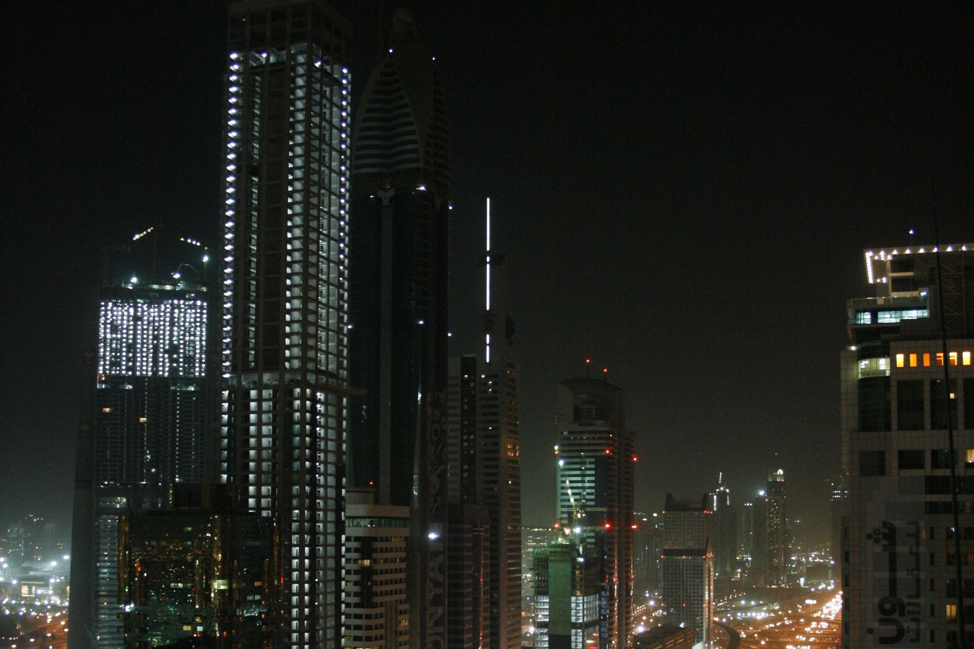 Professional chauffeur opening a luxury car door in Dubai
